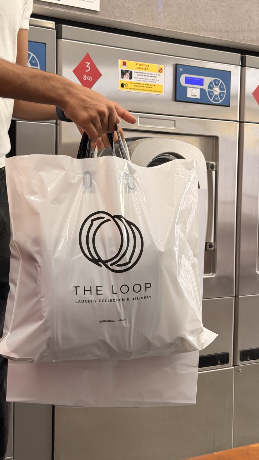 Official THE LOOP bag beside the laundry machines